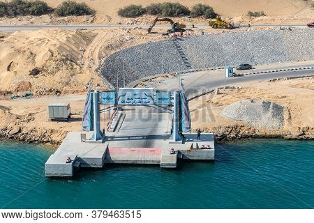 Ismailia, Egypt - November 14, 2019: Port Said - Suez Canal Rd And A Concrete Pier On The Banks Of T