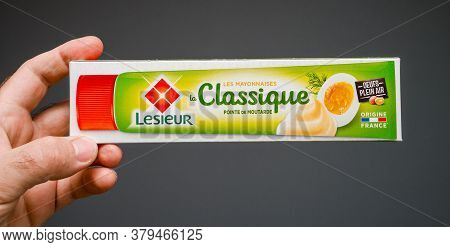 Paris, France - May 29, 2020: Man Hand Holding Against Gray Background Package With Lesieur La Class