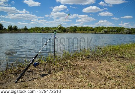 Fishing Rod For Fishing On The Background Of The River And Nature