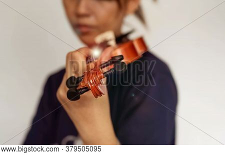 Closeup Of Violin Was Hlding By Human Hand,