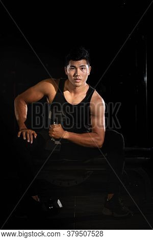Handsome Man Raising Dumbbell,doing Exercise For Buit Muscle,fit And Firm Body,model Posing