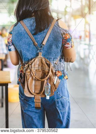 Mini Portable Alcohol Gel Bottle To Kill Corona Virus(covid-19) Hang On A Leather Shoulder Bag Of A 