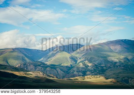 Low Clouds Above Beautiful Green Mountains. Awesome Highland Landscape With Great Mountains Among Lo