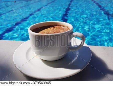 Morning Coffee On The Background Of The Blue Swimming Pool