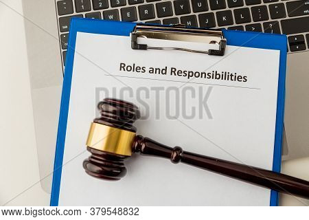 Roles And Responcibilities Document In The Tablet At The Desk.
