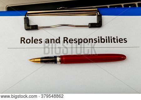 Roles And Responcibilities Document In The Tablet At The Desk.