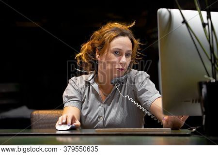 Woman Answers Customer Calls In A Call Center. Secretary Answers The Phone And Talks With Clients, S