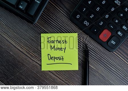 Earnest Money Deposit Write On Sticky Notes Isolated On Office Desk.