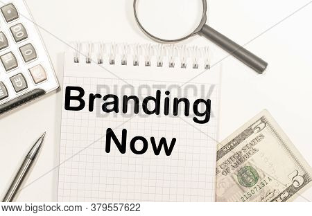 Business Concept - Top View Notebook Writing Branding Now