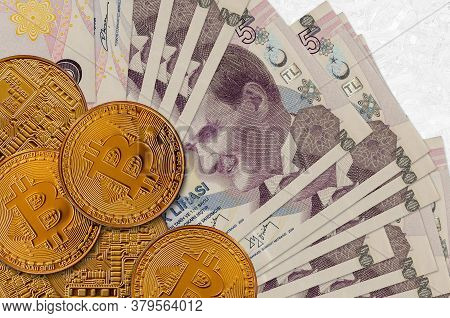 5 Turkish Lira Bills And Golden Bitcoins. Cryptocurrency Investment Concept. Crypto Mining Or Tradin