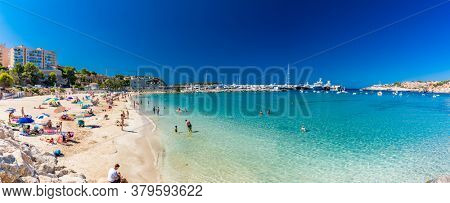 PORT ADRIANO, MALLORCA, SPAIN - 23 July 2020 - Tourists enjoying summer day on the popular city beach.