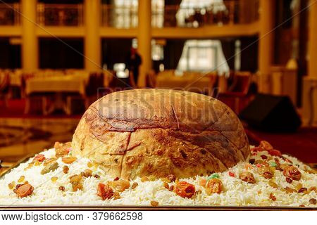 The Azerbaijani Shah Plov Pilaf With Dried Fruit. Restaurant Dish With Rice On A Large Tray.