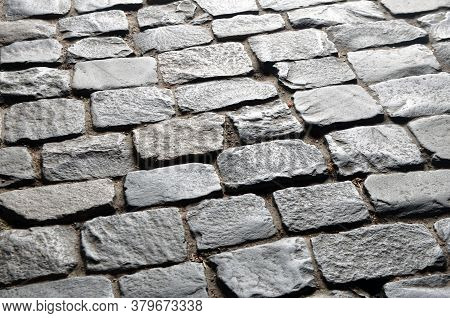An Ancient Pavement Lined With Stone Paving Stones.