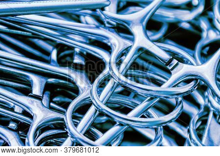 background of a group of sterilized forceps clams used in medical industry