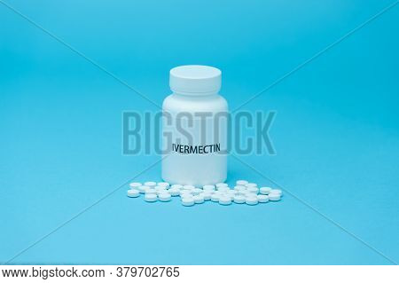 Treatments For Coronavirus (covid-19): Ivermectin In White Bottle Packaging With Scattered Pills. Is