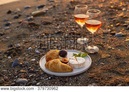 Horizontal Imgae Of A Beach Picnic With Rose Wine, Croissants, Camamber Cheese And Figs. Negative Sp