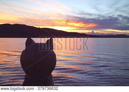 Puma Head Prow Of The Traditional Totora Reed Boat Against Lake Titicaca At Beautiful Sunset, Puno, 