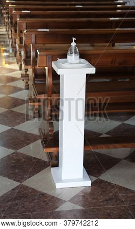 New Stoup With Disinfectant Gel At The Time Of The Coronavirus At The Entrance Of A Church