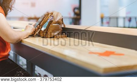 Mini Alcohol Gel Bottle To Kill Corona Virus(covid-19) Hang On A Leather Shoulder Bag Of A Woman Wea