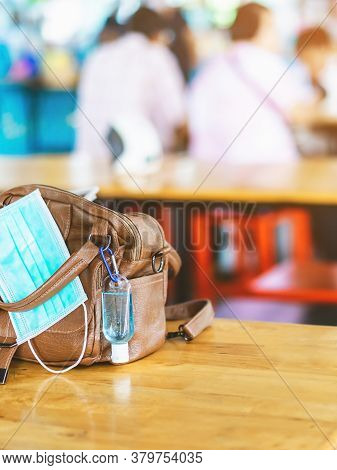 Mini Portable Alcohol Gel Bottle To Kill Corona Virus(covid-19) Hang On A Leather Shoulder Bag Of A 