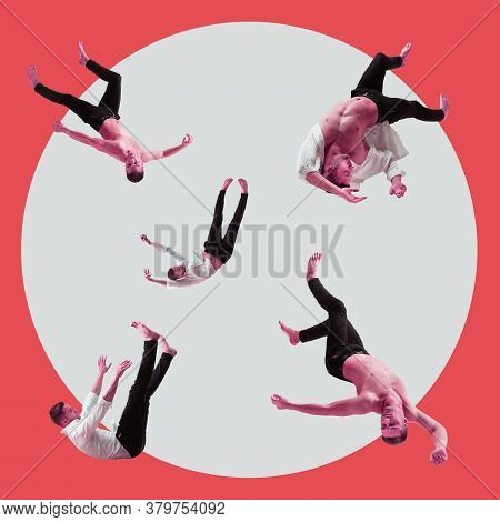 Mid-air Beauty Cought In Moment. Full Length Shot Of Young Man Hovering In Air And Keeping Eyes Clos
