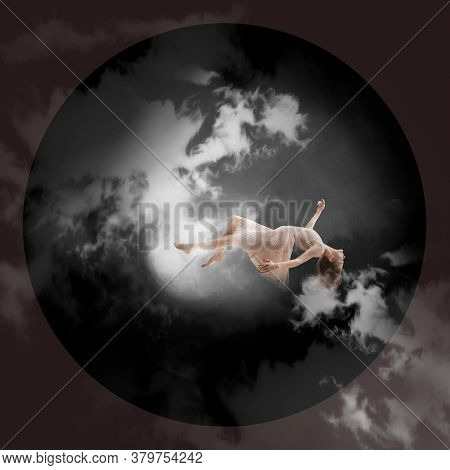 Mid-air Beauty, Moonlight. Full Length Shot Of Attractive Young Woman Hovering In Air And Keeping Ey