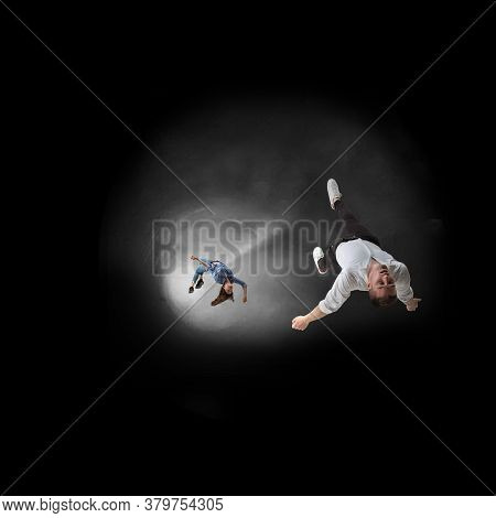 Mid-air Beauty Cought In Moment. Full Length Shot Of Attractive Young Woman And Man Hovering In Air 