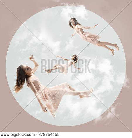 Mid-air Beauty Cought In Clouds. Full Length Shot Of Attractive Young Woman Hovering In Air And Keep