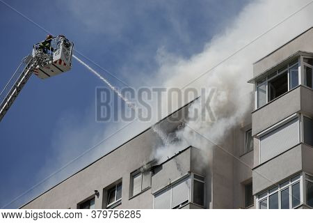 Bucharest, Romania - August 6, 2020: Firefighters Try To Extinguish A Fire That Spread Across An Apa
