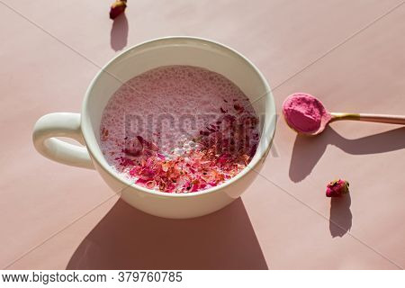 Cup Of Rose Cardamom Ayuverdic Drink On Pink Background.