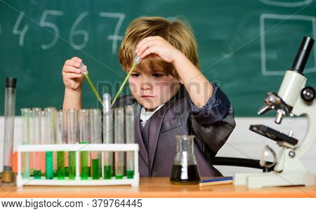 Small Boy At Science Camp. Microscope At Lab. Scientific Experiment. Pupil Looking Through Microscop