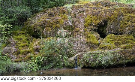 Waterfall At City Rauna, Latvia. River With A Rocky Bottom And Rauna Staburags Cliff. A Unique Rock 