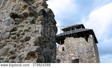 Medieval Castle Ruins In Latvia Rauna. Old Stoune Brick Wall Of Raunas Castle Where Was Living Archb