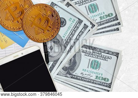 100 Us Dollars Bills And Golden Bitcoins With Smartphone And Credit Cards. Cryptocurrency Investment
