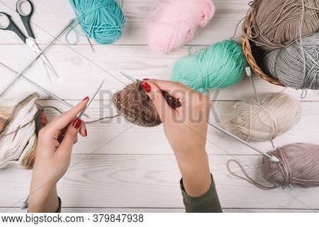 Knitting In Woman Hands. Close-up Of Hands Knitting. Colorful Threads. Selection Of Colorful Yarn Wo