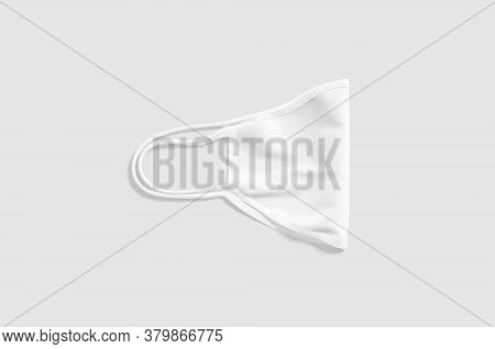 Blank White Fabric Folded Face Mask Mockup Lying, Gray Background, 3d Rendering. Empty Protect Cotto
