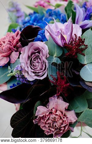Close-up Bouquet Of Of Flowers On A Light Background. Bouquet Of Eucalyptus, Carnation, Hydrangea, R