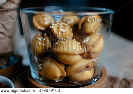 Dumplings With Sesame Seeds On Black Background
