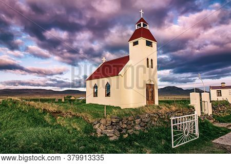 Typical Iceland Wooden Church At Sunset In Small Village, In The Northern Iceland, Scandinavia