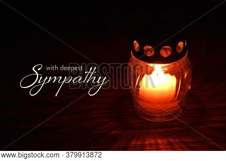 Sympathy Card With Votive Candle On Dark Background
