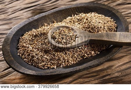 Dried Anise Seeds In Wooden Spoon - Pimpinella Anisum