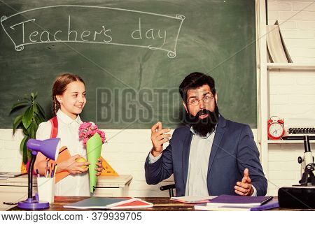 Spring. Back To School. Happy Teachers Day. Small School Girl Kid With Flower Bouquet. Knowledge Day