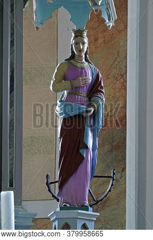 BRDOVEC CROATIA - SEPTEMBER 17, 2012: St. Catherine of Alexandria statue on the altar of St. Barbara in Church of St. Vitus in Brdovec, Croatia