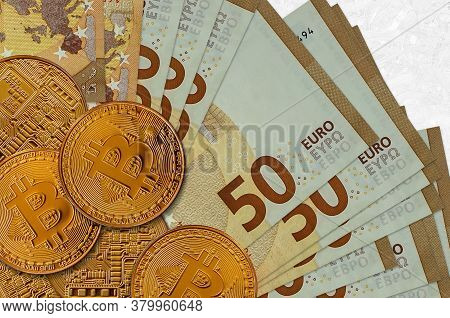 50 Euro Bills And Golden Bitcoins. Cryptocurrency Investment Concept. Crypto Mining Or Trading