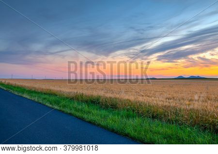 Barley Field And Amazing Sunset In Czech Bohemian Upland, Czech Republic.  Uplands Are A Nature Rese