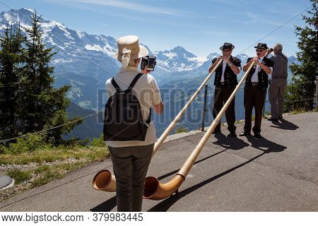 Schynige Platte, Bernese Oberland, Switzerland - August 1 2019 : 2 Alpenhorn Players In Traditional 