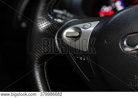Novosibirsk/ Russia - August 01  2020: Infiniti Fx, Car Controller On Steerling Wheel ,music,control