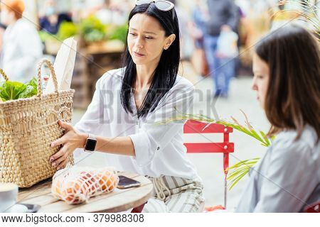Brunette Slim Sensual Mother And Her Teenager Daughter Relaxing After Shopping At Farmer Market, Sit