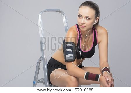 Young Female Athlete On Ladder