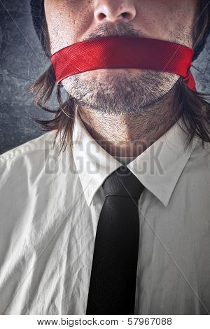 Businessman With Red Strip Over Mouth